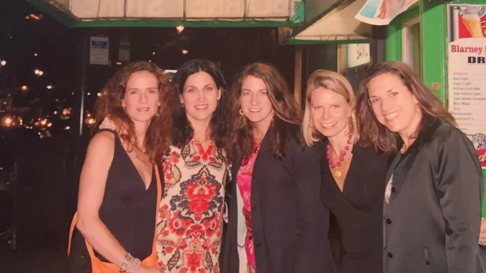 Laura Marshall, pictured center, alongside four friends from her time with Virginia track and field.