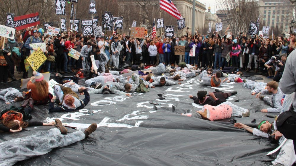 	Hundreds of students from more than 40 universities and 42 states set up mock oil spills outside of Secretary of State John Kerry’s house and the White House while others zip-tied themselves to the White House fence.