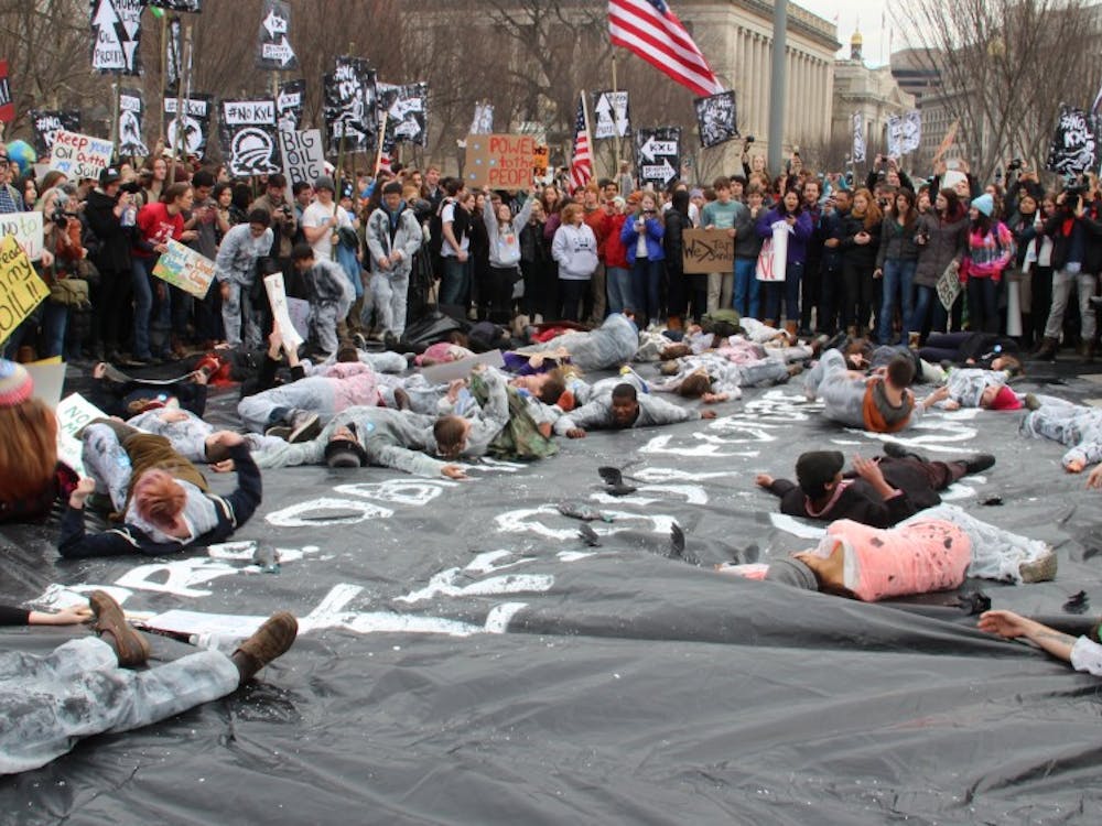 Hundreds of students from more than 40 universities and 42 states set up mock oil spills outside of Secretary of State John Kerry’s house and the White House while others zip-tied themselves to the White House fence.