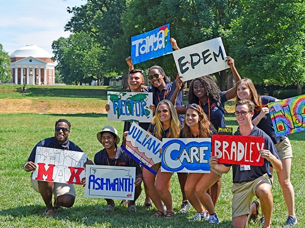 Orientation leaders show off their signs.