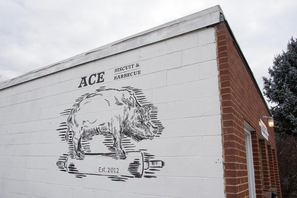 <p>Ace is a quintessential barbecue joint in every sense of the phrase — from the painted white brick exterior, to the chalkboard chock-full of daily specials and savory meat combinations, to the plethora of pig decorations on every available surface&nbsp;</p>