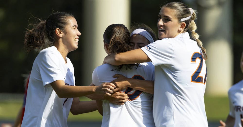 The Cavaliers celebrate after a critical goal versus Southern Methodist.