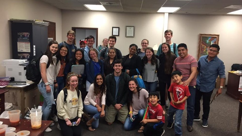 Student volunteers pose with participants in the Sín Barreras program this semester.