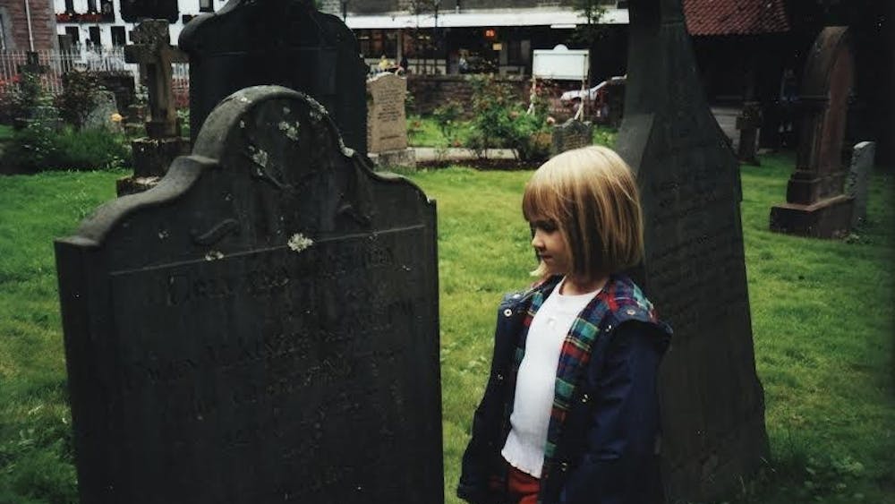 Tori Travers explores a graveyard in Scotland at the age of five.