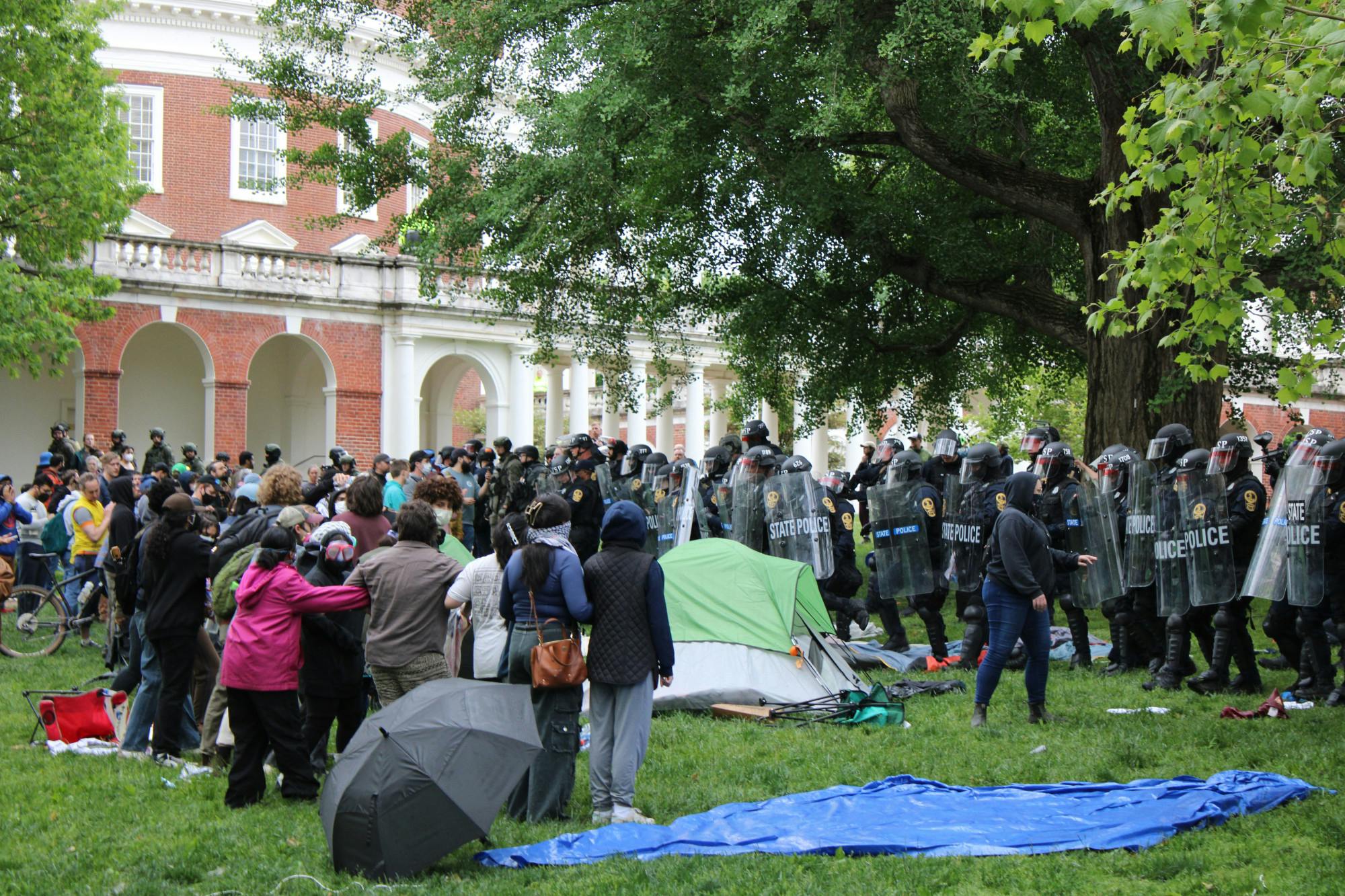 Virginia State Police in riot gear advanced on the encampment, using chemical irritants and detaining several protestors.