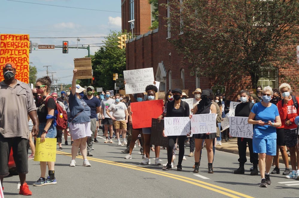 Hundreds peacefully marched from the Charlottesville Police Department to Washington Park Saturday.