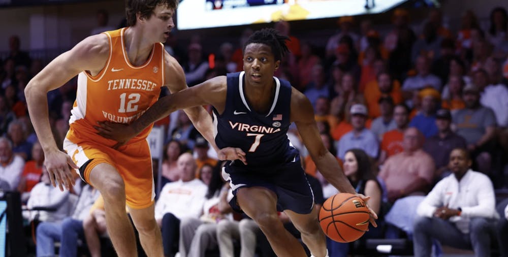 <p>Dai Dai Ames drives against Tennessee sophomore forward Cade Phillips.</p>