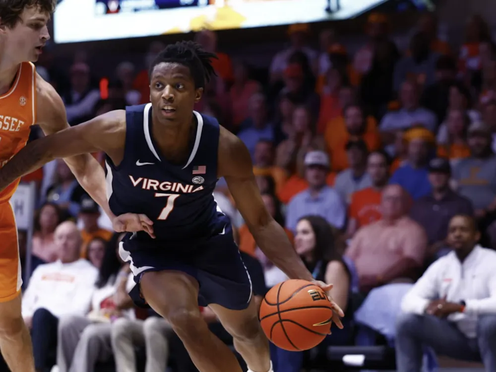 Dai Dai Ames drives against Tennessee sophomore forward Cade Phillips.