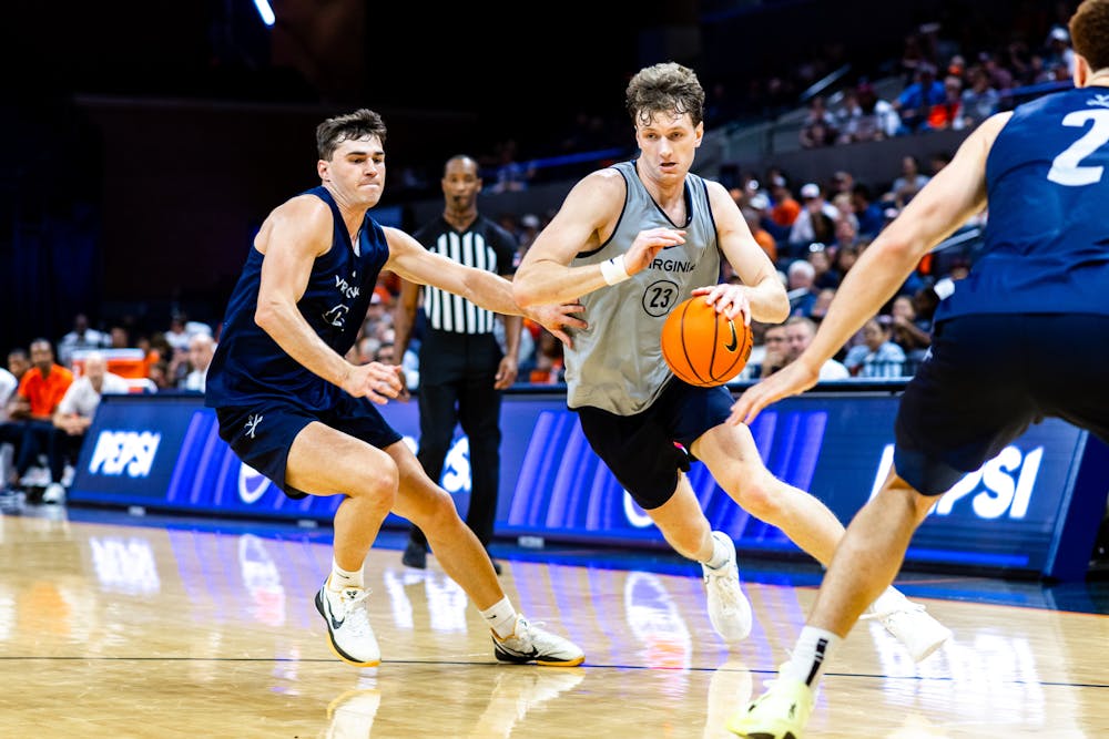 <p>Sophomore forward TJ Power attacks during the recent Blue-White Scrimmage.</p>