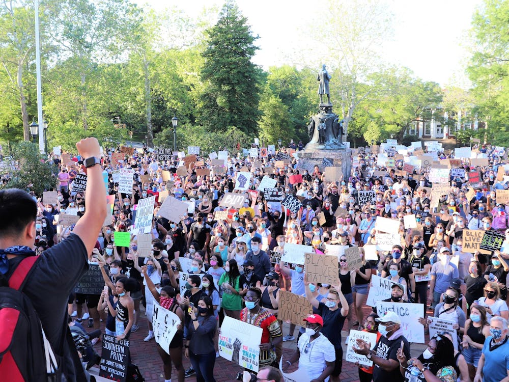 The march to remove Confederate monuments in Charlottesville convened at the Rotunda after marching from downtown. (CD Photo // Geremia Di Maro)