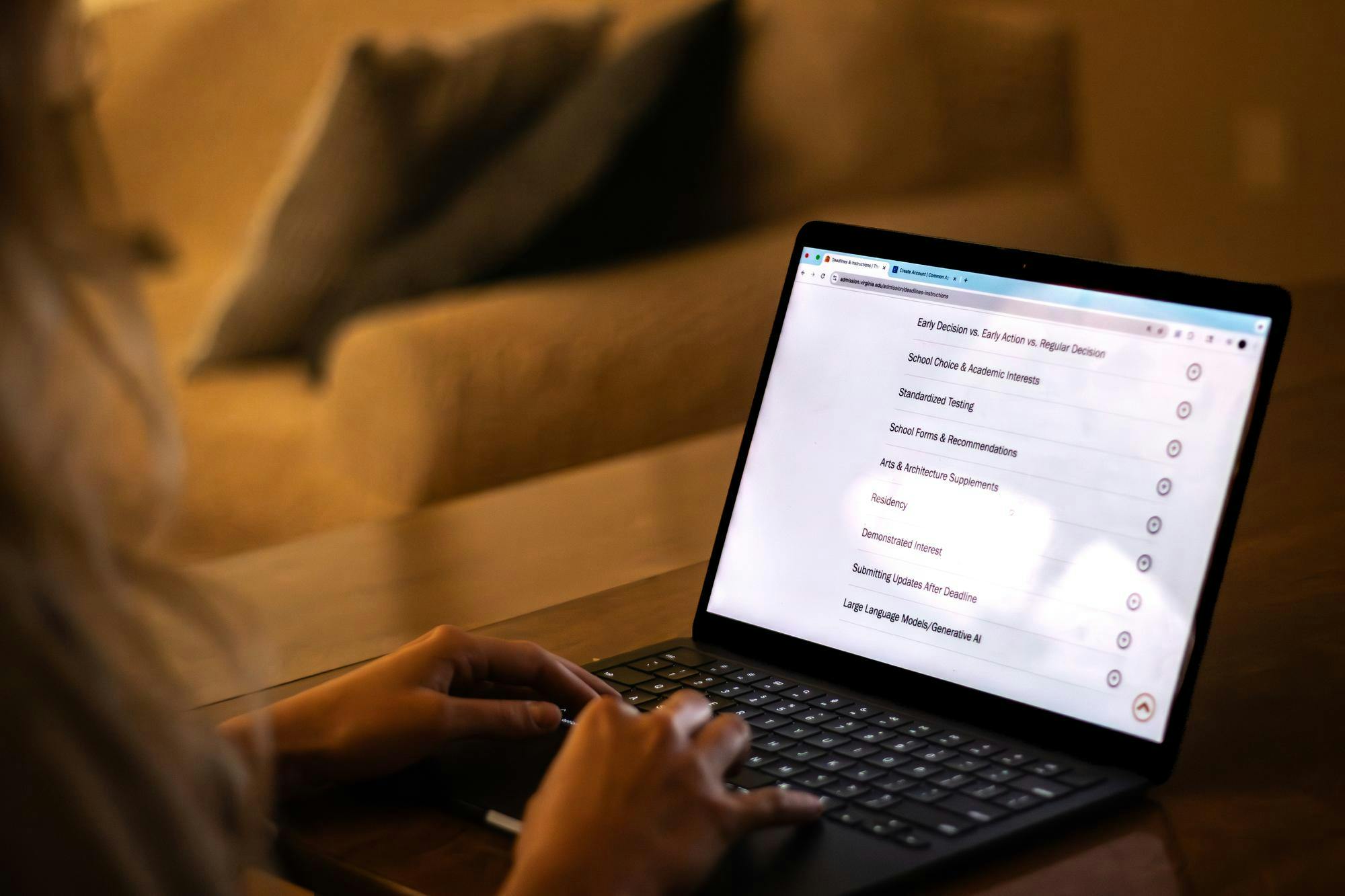 A student reads over the Office of Admission website Sept. 25, 2025, which explains the U.Va. admissions process.
