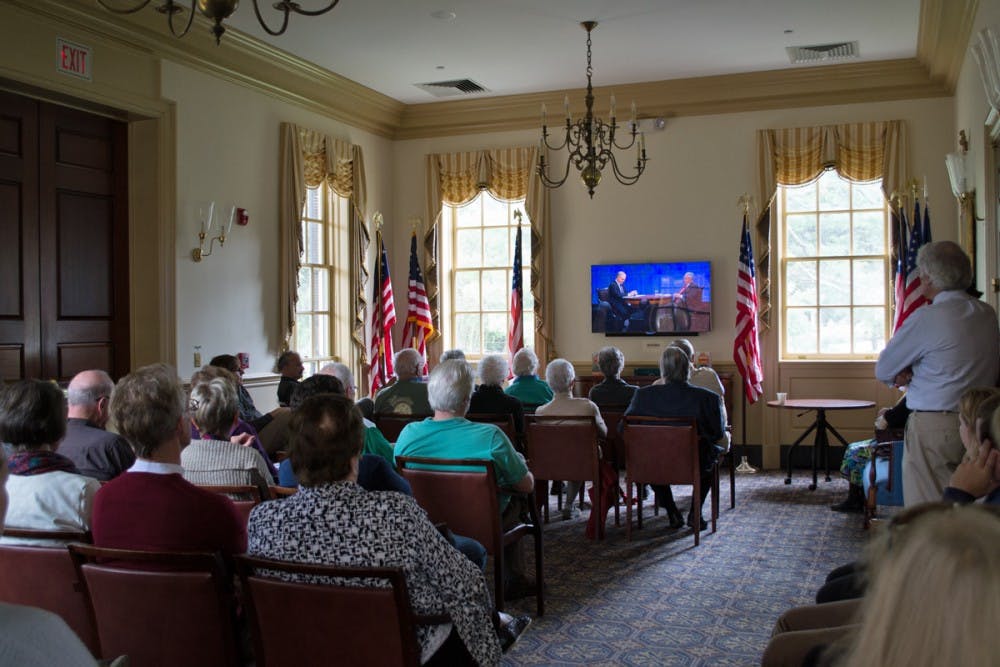 Community members watching American Forum with Blackmon and Kristol.&nbsp;