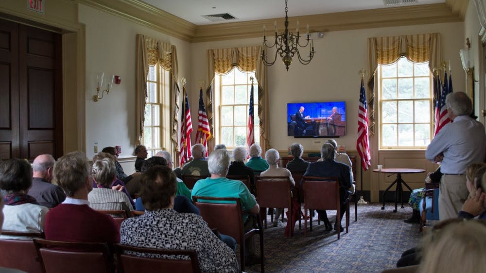 Community members watching American Forum with Blackmon and Kristol.&nbsp;