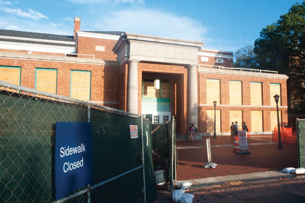 	The University Bookstore joins the Amphitheater, the Alderman Road Residential Area and Newcomb Hall, above, which still has no front windows or accessible second floor, as one of many construction sites around Grounds.