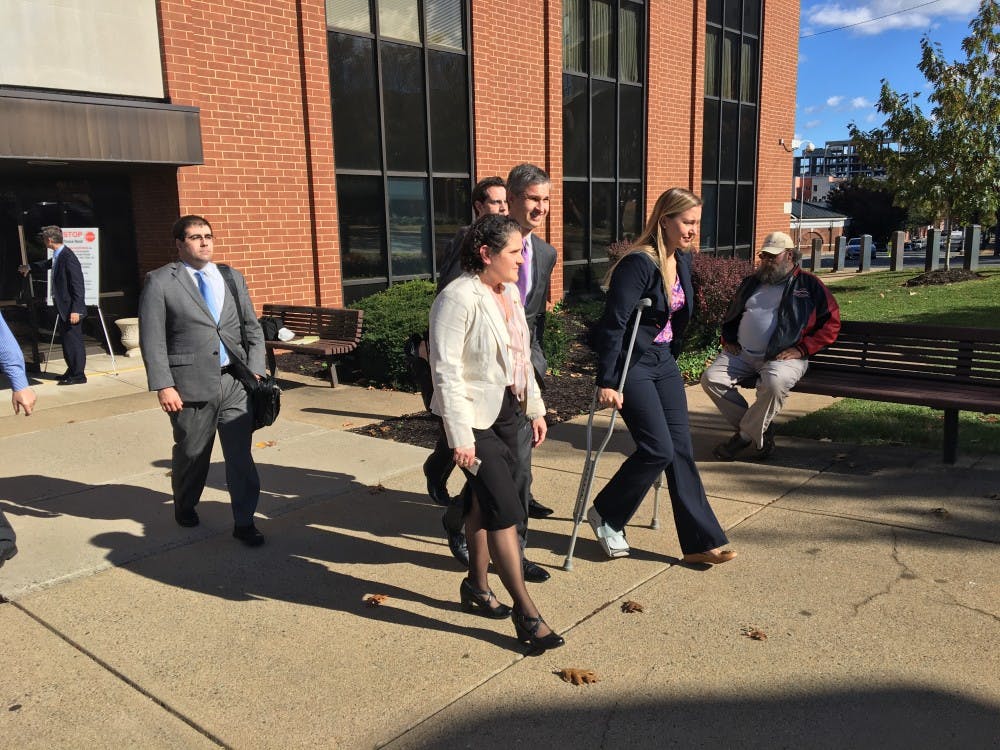 Eramo exits the courthouse after the jury finds in her favor.