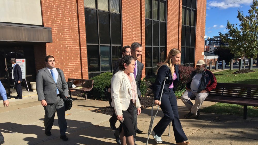 Eramo exits the courthouse after the jury finds in her favor.