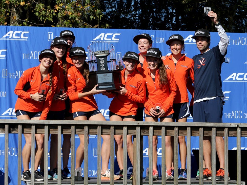 Members of the Virginia Cavaliers celebrate their Championship after the 2015 ACC Cross Country Championship in Tallahassee, Fl., Friday,Oct. 30, 2015. (Photo by Glenn Beil, theACC.com)
