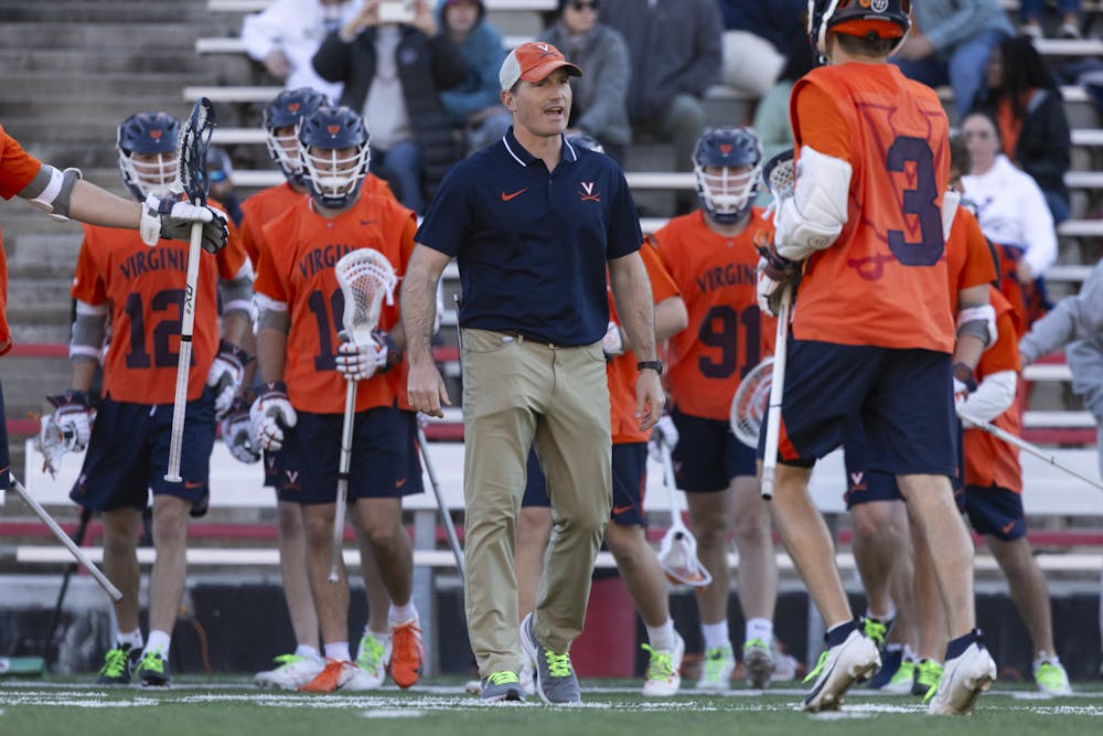 <p>Cassese encourages sophomore attackman Truitt Sunderland during the Cavaliers' game against Maryland.&nbsp;</p>