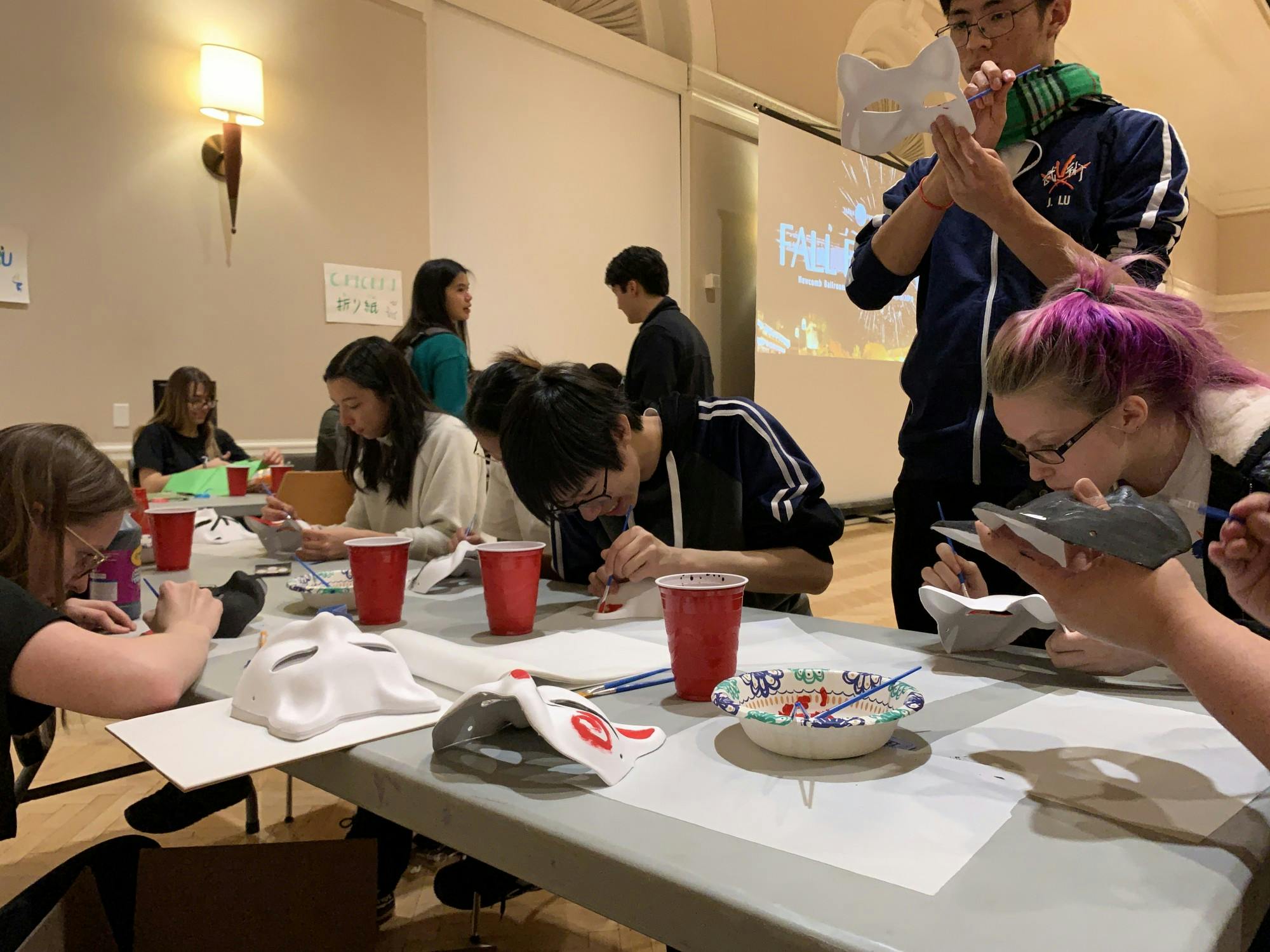 Students painted fox-shaped masks at one of the booths, an animal that holds traditional value in Japanese culture.