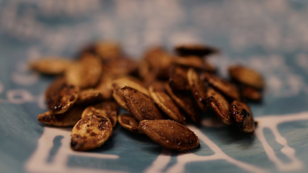 Roasted pumpkin seeds are easy to make, and they can be the perfect snack for second-round midterm cramming.&nbsp;