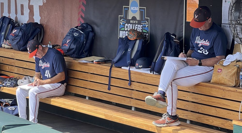 Pitching coach Drew Dickinson and Coach Brian O'Connor prepare for competition at the 2024 College World Series in Omaha, Neb.