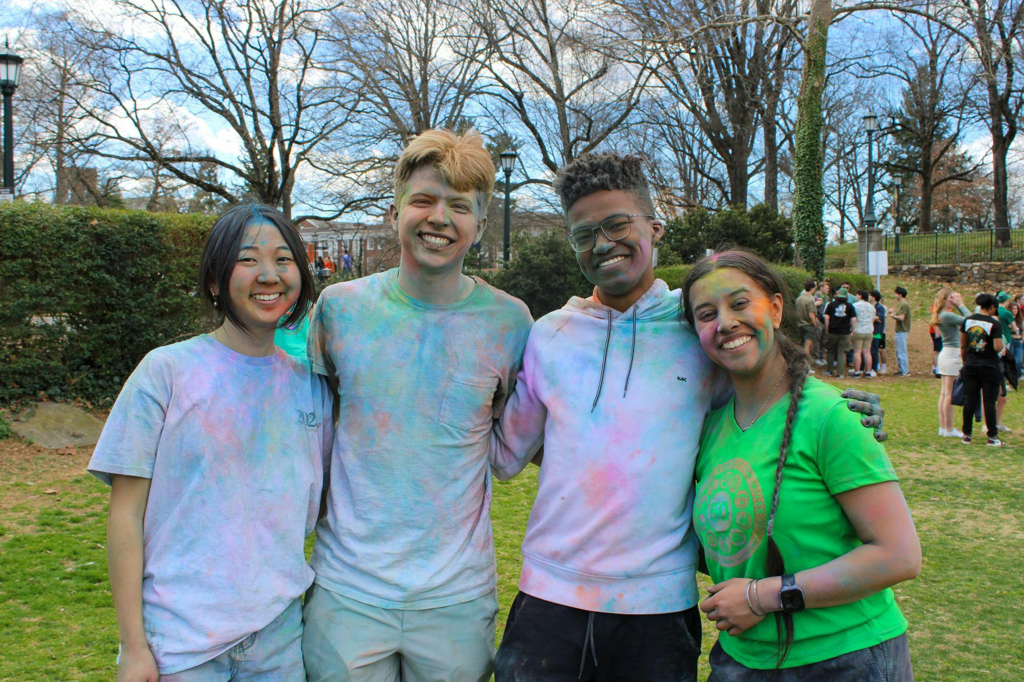 At the end of the celebration, attendees grabbed cups filled with bright powder and engaged in the Holi tradition of playfully throwing color at each other.