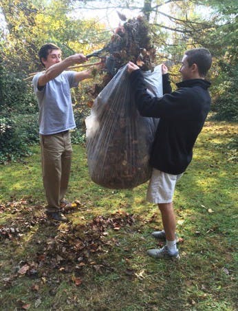 Student volunteers participate in the Habitat for Humanity's annual Rake-a-Thon.&nbsp;