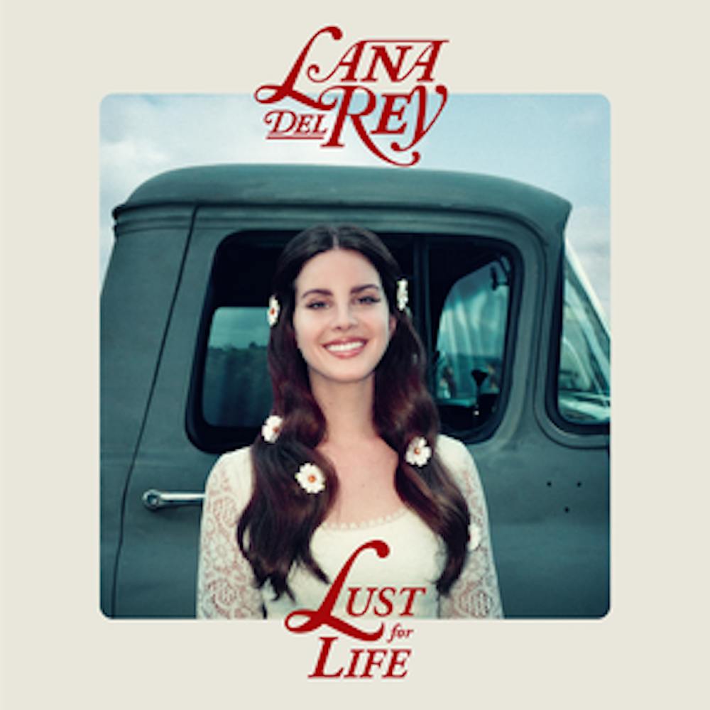 Look no further than the album cover for an appropriate metaphor &mdash; as with all her previous releases, the cover of “Lust for Life” features Del Rey posing in front of a car. Only this time, she actually smiles.