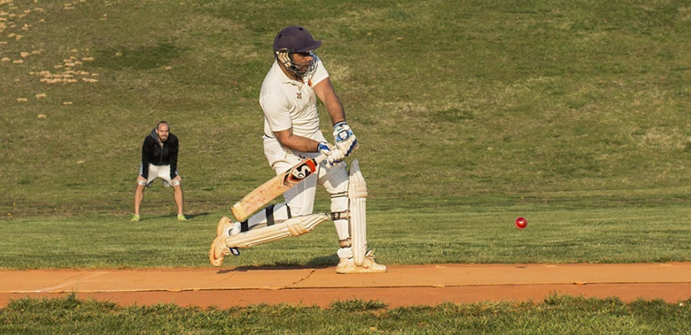 The batter prepares to deal damage against the opposing bowler.