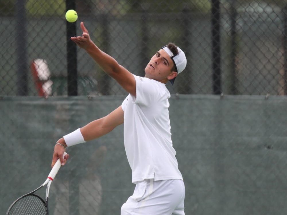 Freshman William Woodall helped clinch the doubles point for Virginia.&nbsp;