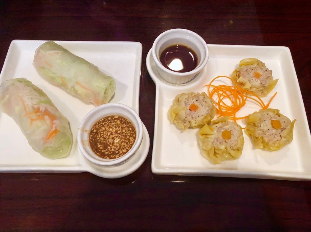<p>To the left is the Fresh Vegetables Rolls and to the right the Kanom Jeeb — both appetizers offered for under $6.&nbsp;</p>