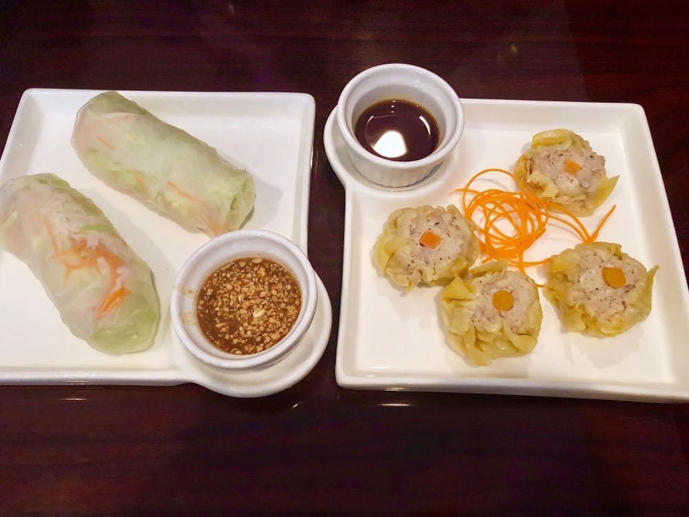 To the left is the Fresh Vegetables Rolls and to the right the Kanom Jeeb — both appetizers offered for under $6. 