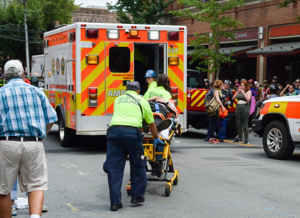 Medical personnel helping someone who was injured when a car plowed through a crowd of people&nbsp;near the Downtown Mall.&nbsp;