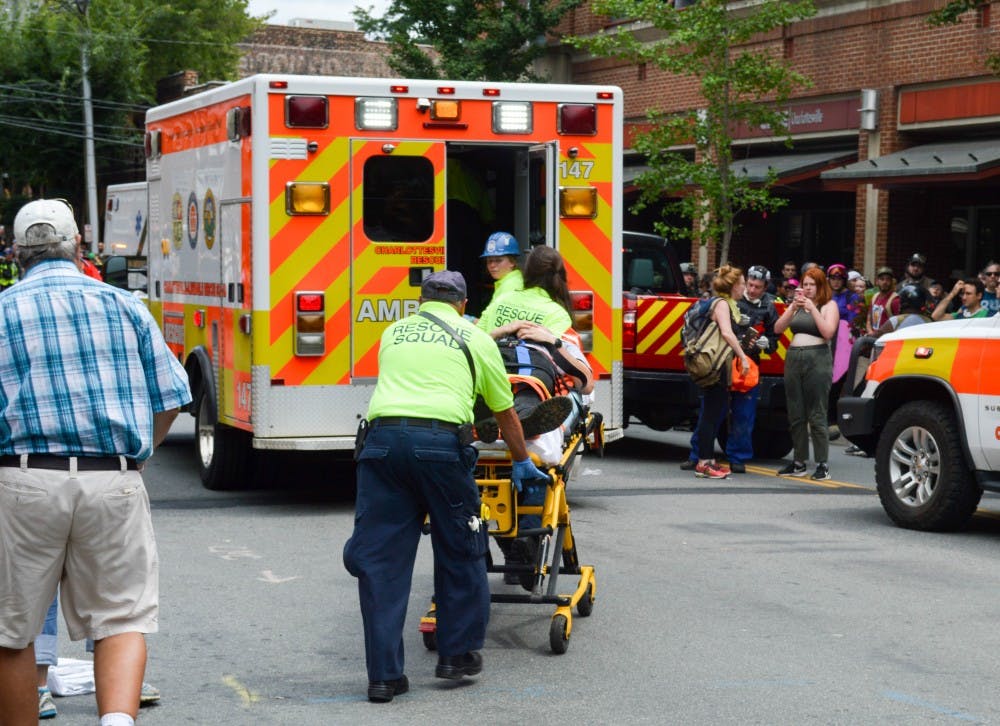 <p>Medical personnel helping someone who was injured when a car plowed through a crowd of people&nbsp;near the Downtown Mall.&nbsp;</p>