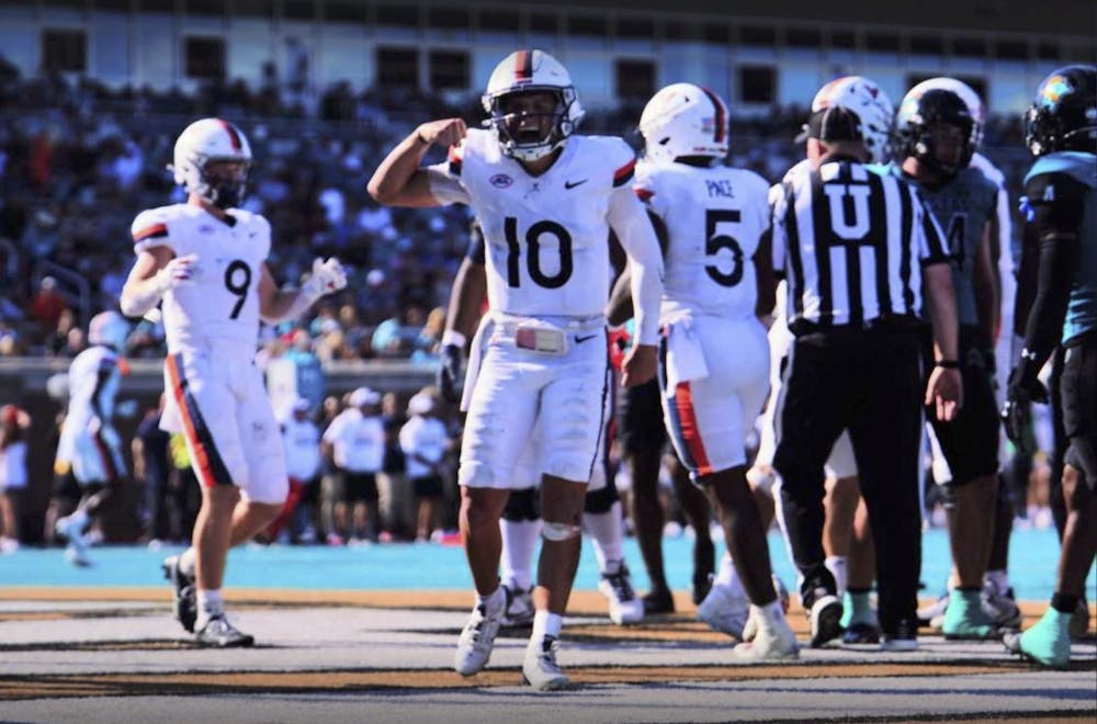 <p>Sophomore quarterback Anthony Colandrea celebrates a Cavalier touchdown.</p>