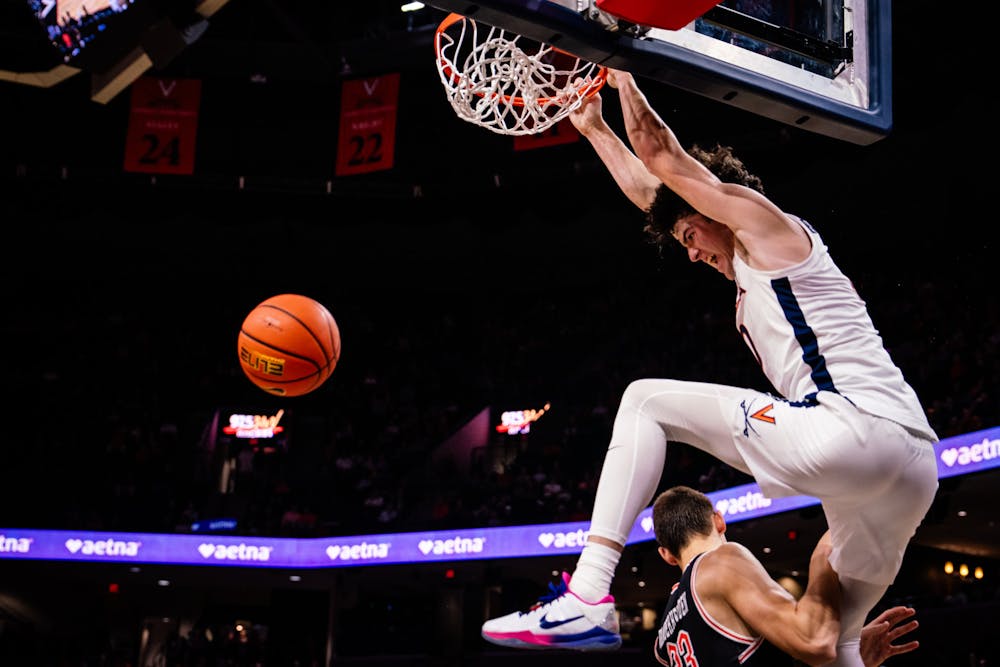 Sophomore forward Blake Buchanan throws down a ferocious dunk against Campbell Nov. 6.