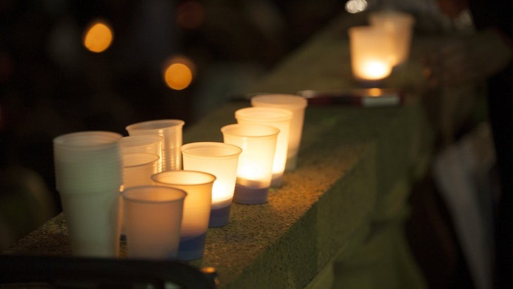 As the sun set Friday night, dozens gathered for a candlelight vigil at Ern Commons, where survivors of sexual assault and abuse, loved ones of survivors and allies from both the University and the greater Charlottesville communities gathered to share their stories.
