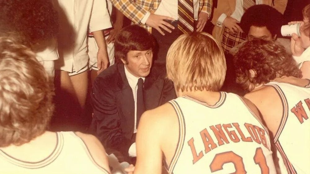 Holland won 326 games as Virginia's head coach and just over 400 for his career.