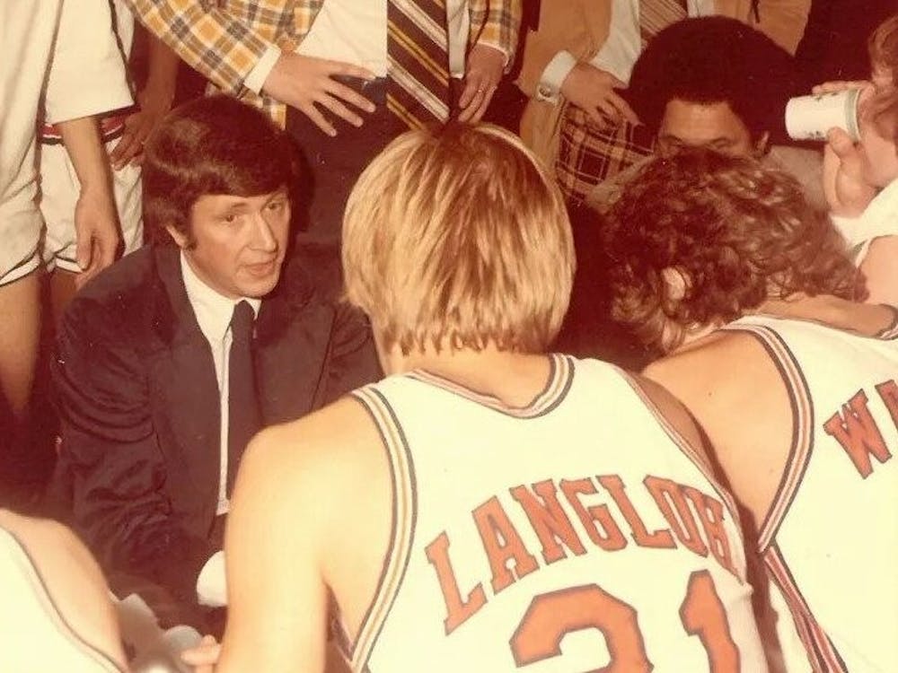 Holland won 326 games as Virginia's head coach and just over 400 for his career.