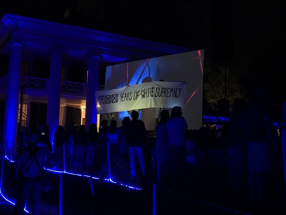 The banner the arrested students held up read, "200 Years of White Supremacy."