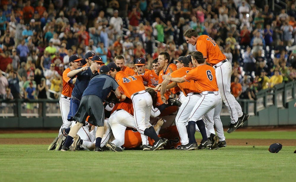 <p>Virginia dogpiles on the infield grass at TD Ameritrade Park after the final out of the ninth inning, which came on a wicked slider from junior lefty Nathan Kirby.  </p>