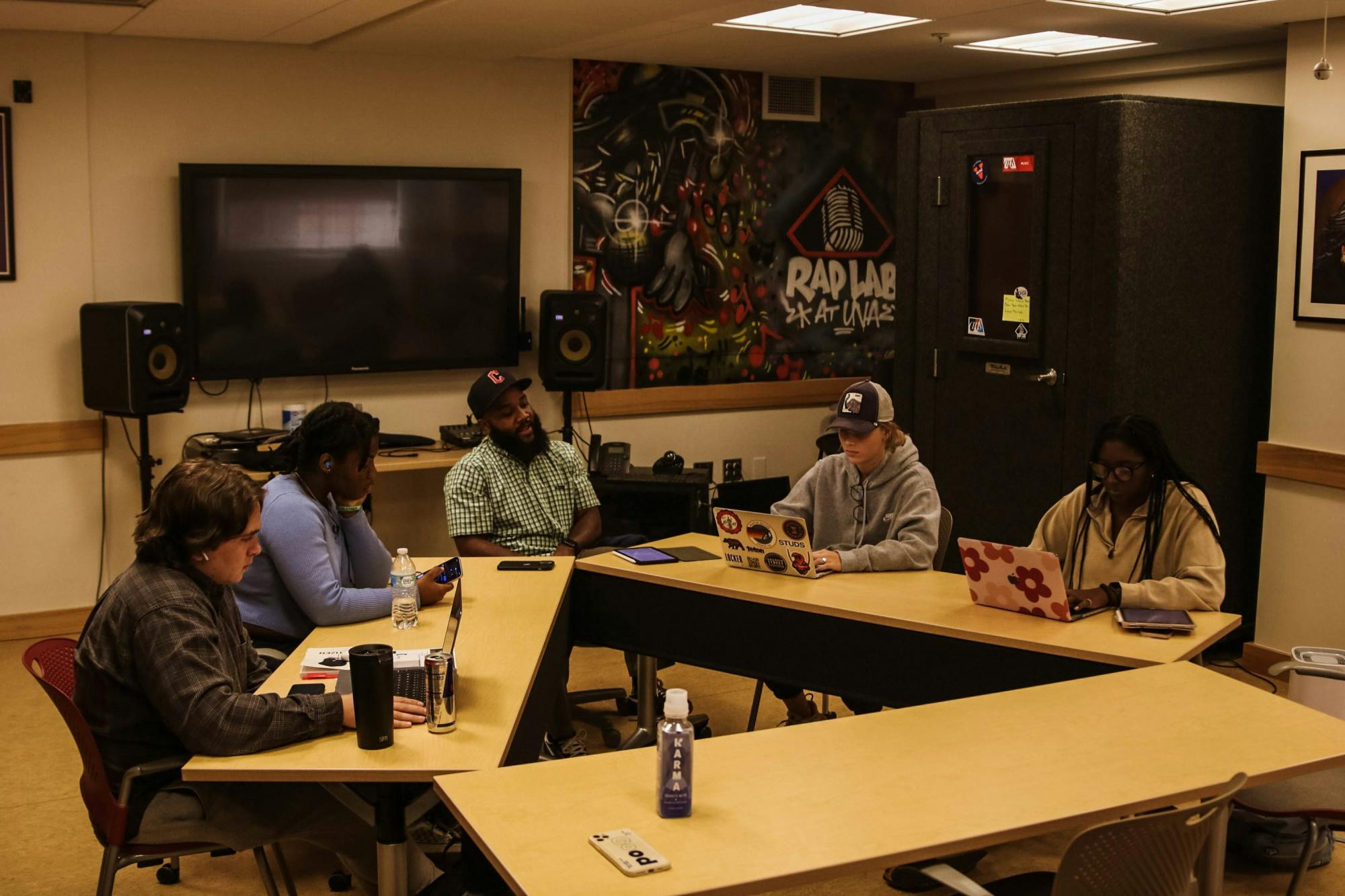 Professor Carson sits with students at the Rap Lab of U.Va