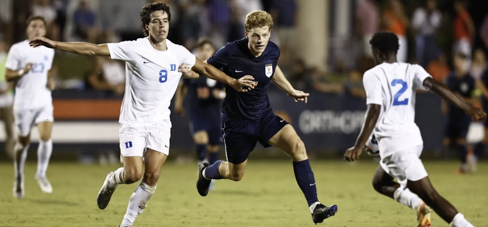 <p>Graduate forward Hayes Wood battles a Duke defender.</p>