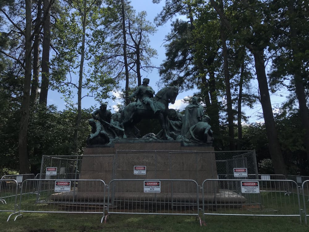 On Thursday, after sustaining damage to Clark's neck, the statue was surrounded with construction fencing and guarded by an Ambassador.