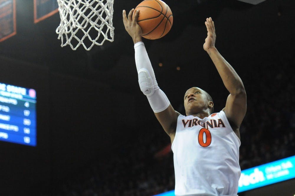 Virginia senior guard Devon Hall missed two free throws in the final 31 seconds of overtime play against Virginia Tech Saturday night.