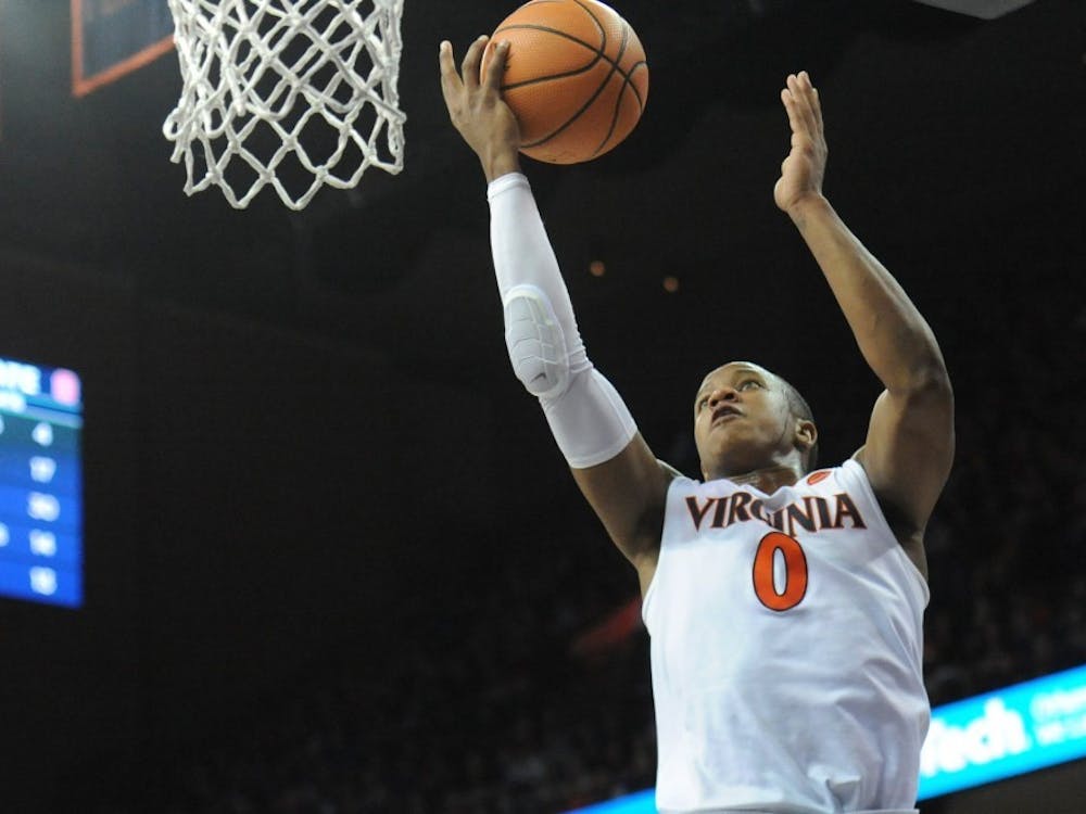 Virginia senior guard Devon Hall missed two free throws in the final 31 seconds of overtime play against Virginia Tech Saturday night.