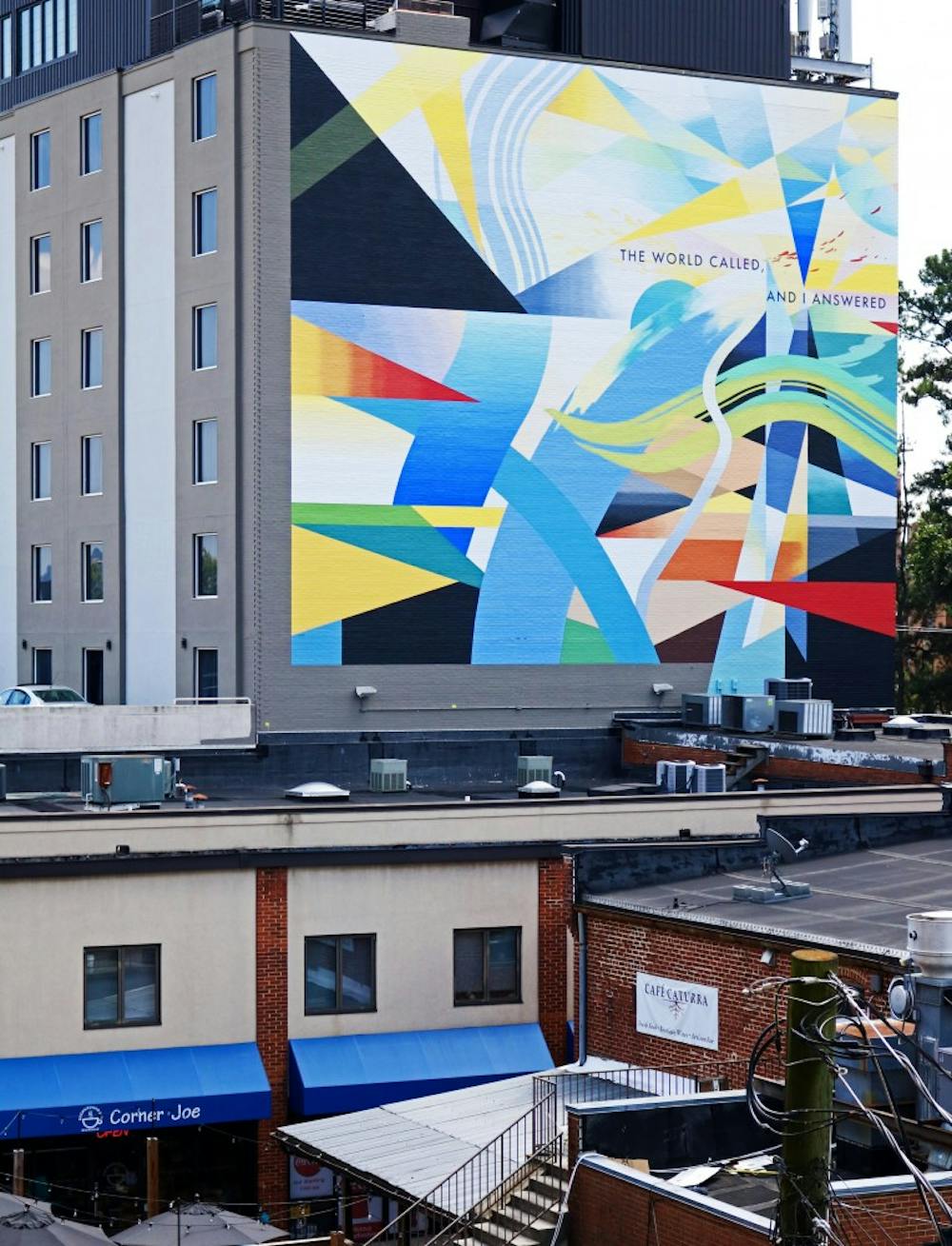 <p>The mural &mdash; painted by artist David Guinn &mdash; debuted on the southwest wall of the hotel in August and includes a quote from “Testimonial,” a poem by U.S. Poet Laureate and English Prof. Rita Dove.</p>