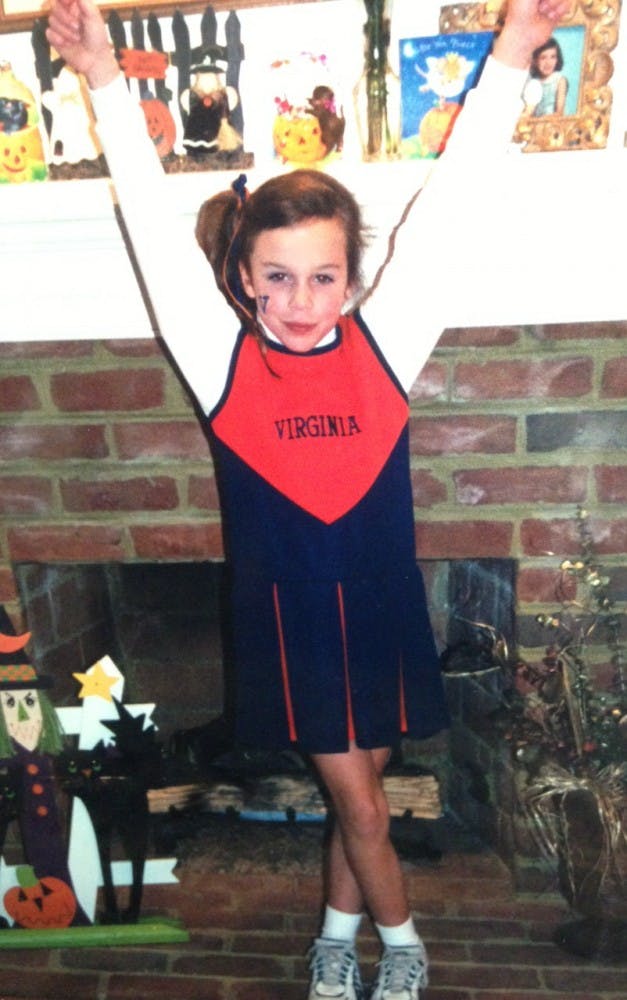 	Rivas, in 2000, dressed as a Virginia cheerleader for Halloween.