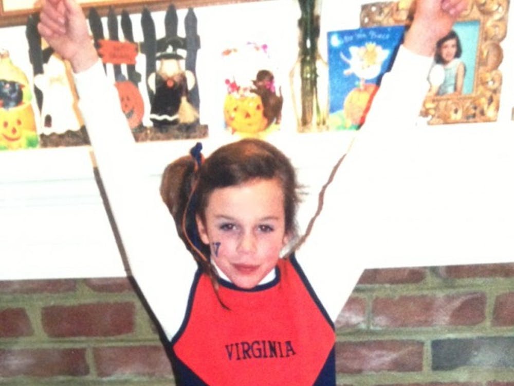 	Rivas, in 2000, dressed as a Virginia cheerleader for Halloween.