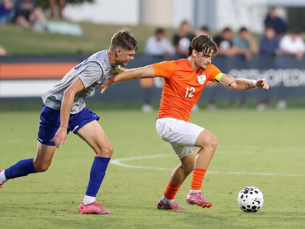 Albin Gashi operates near midfield, an American defender hounding him.
